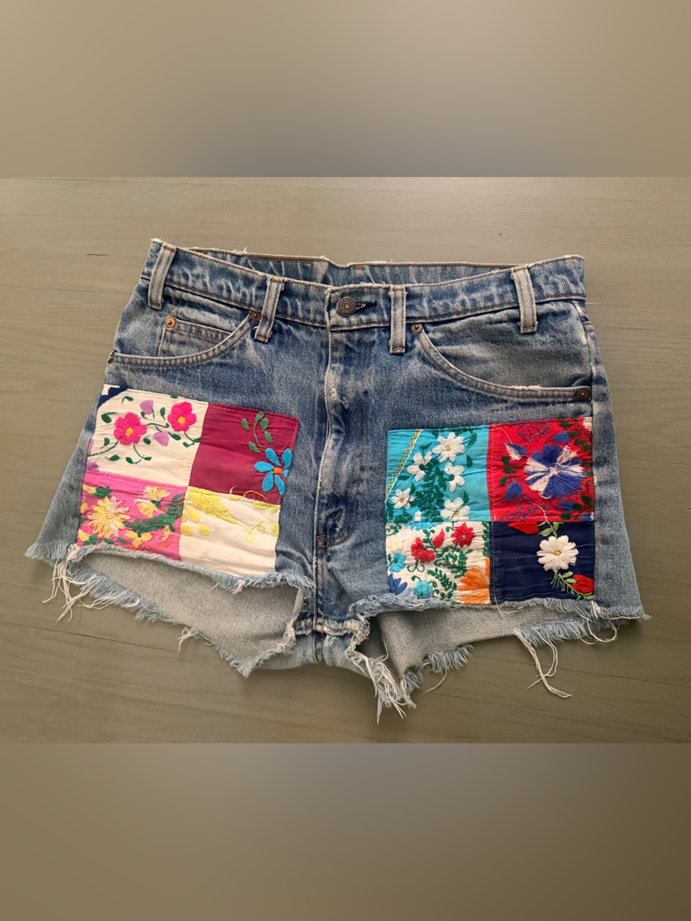 Levi's Blue Denim Cutoff Shorts with Colorful Floral Patchwork